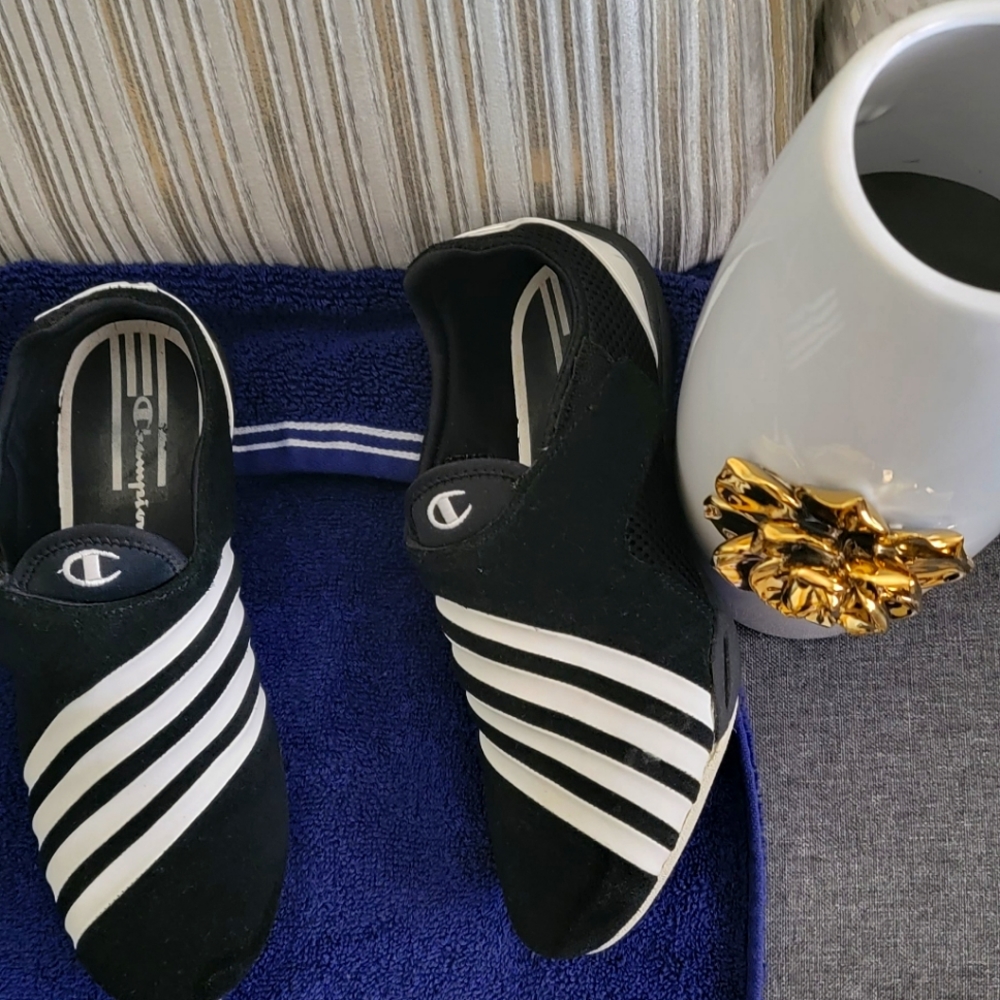 Black and white striped Champion tennis shoes.